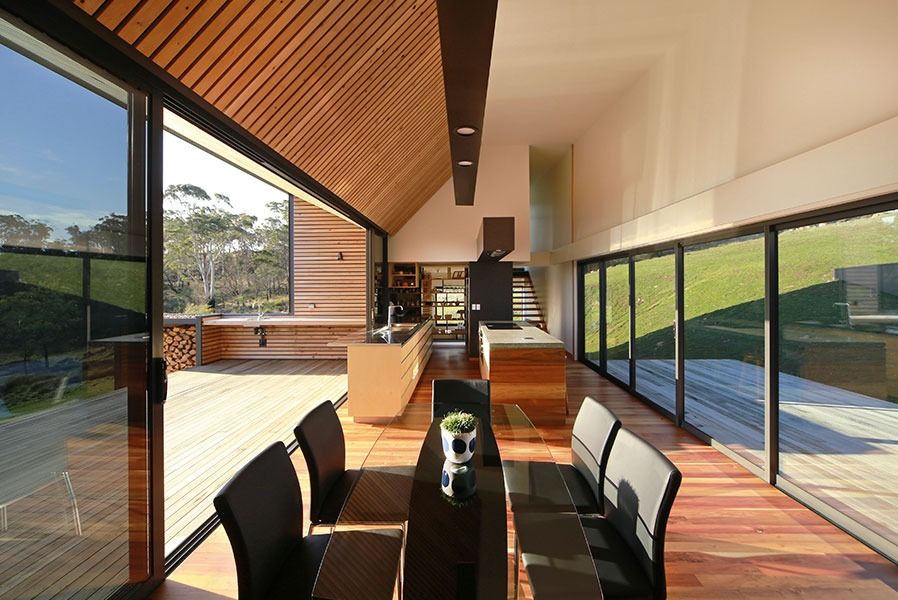 A Dining Room In A House With A Table And Chairs — New England Glass & Aluminium In Armidale, NSW