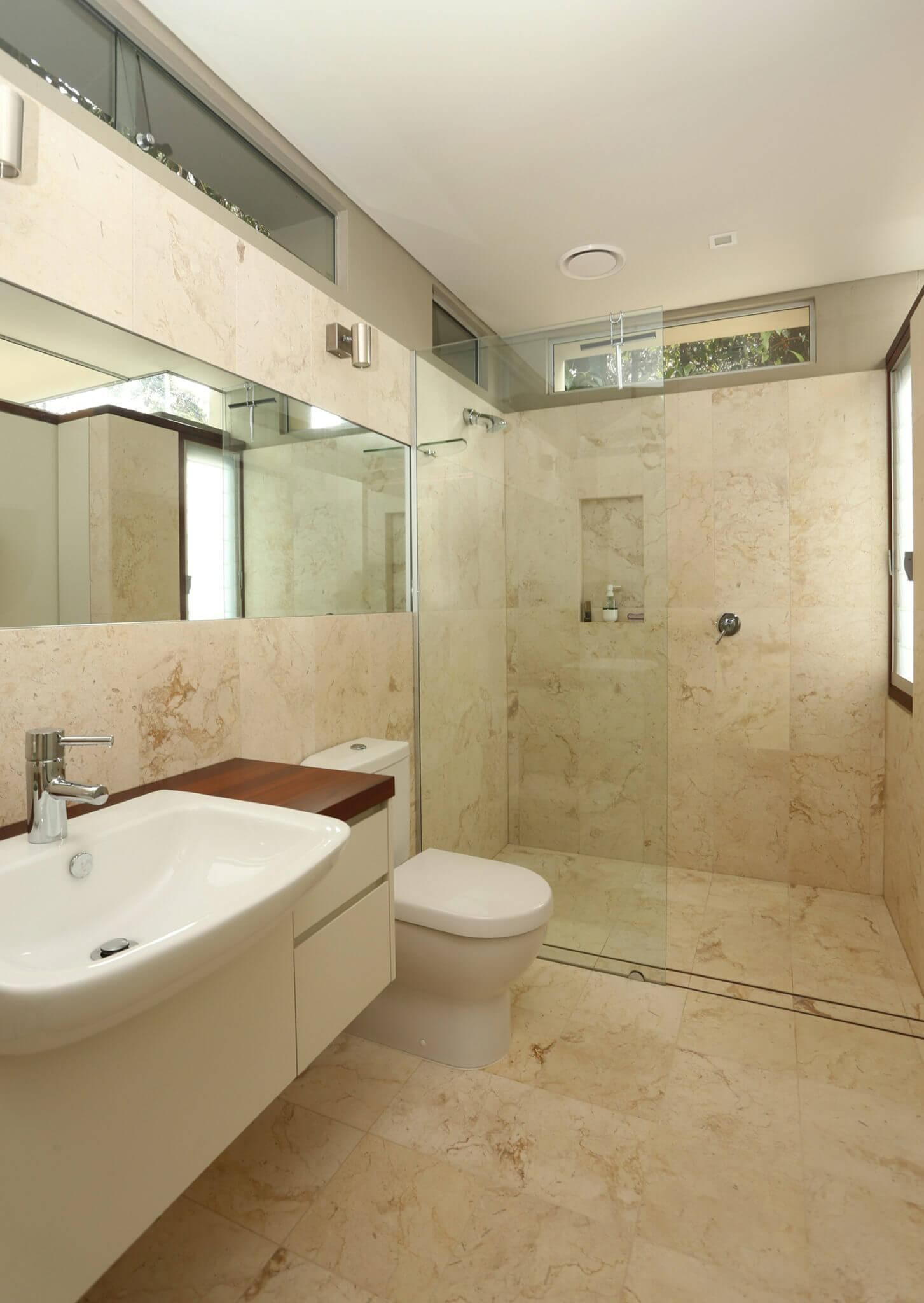 A Bathroom With A Toilet A Sink And A Walk In Shower — New England Glass & Aluminium In Armidale, NSW