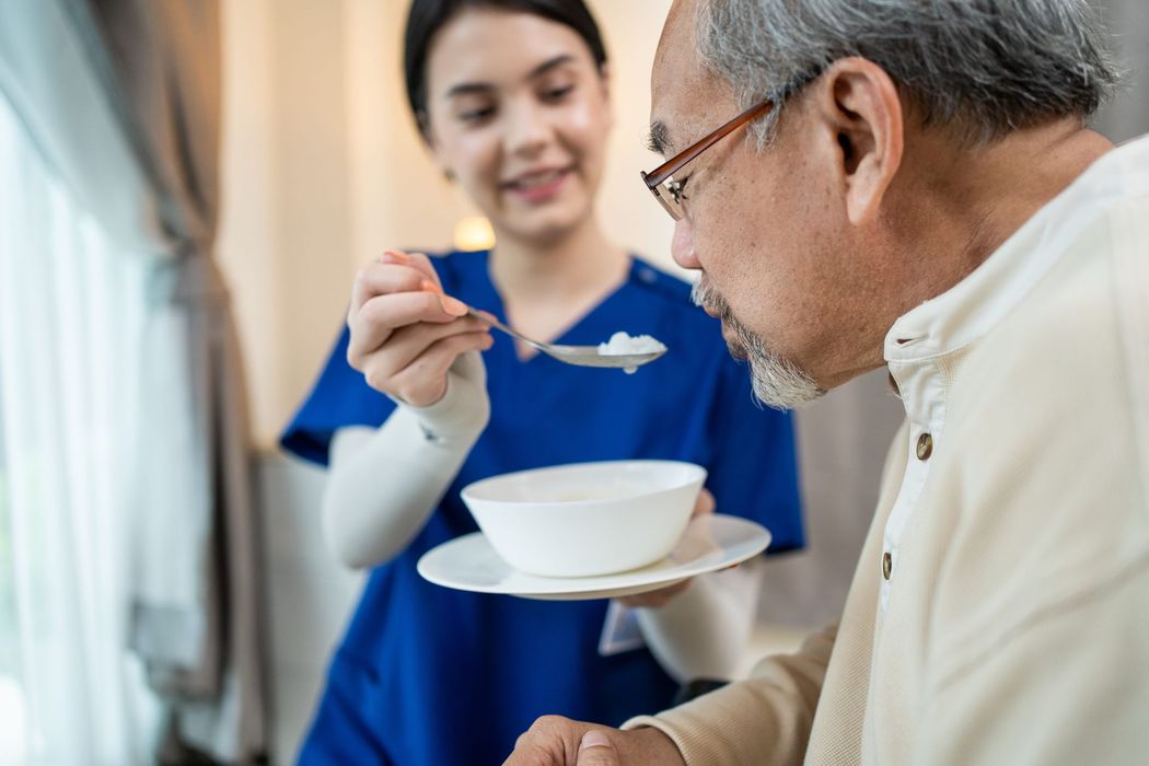 Caregiver supporting a diverse group of clients including seniors and veterans