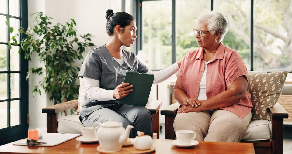 Caregiver sharing a warm moment with a client at home