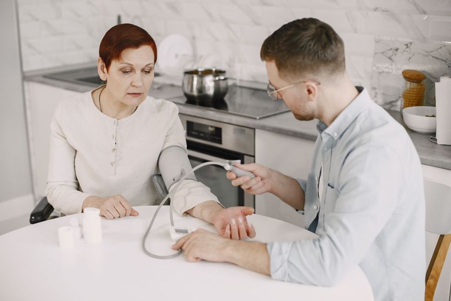 Caregiver assisting client at home