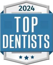 2024 Top Dentists badge in blue, white, and gray with three stars