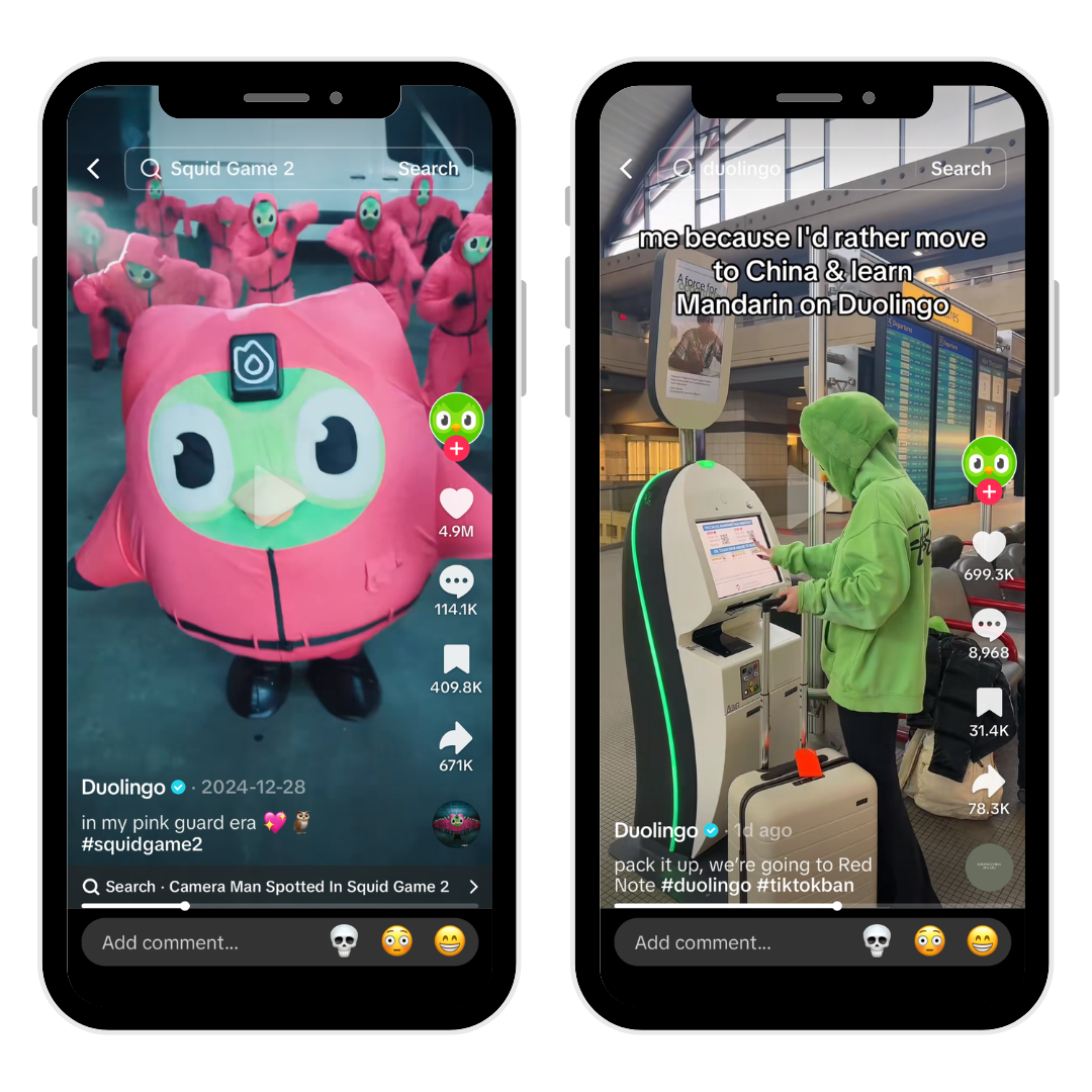 A woman in a green hoodie is standing next to the Duolingo owl mascot.