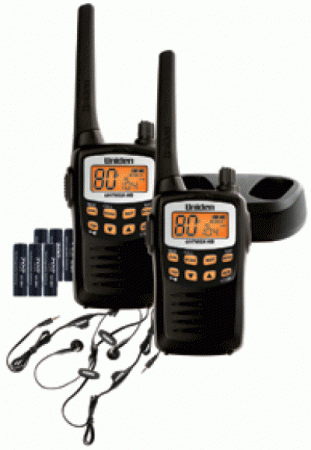 Two walkie talkies are sitting next to each other on a charger.