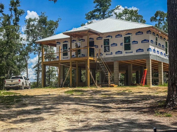 Homeowner submitting detailed roof inspection request form to a professional.