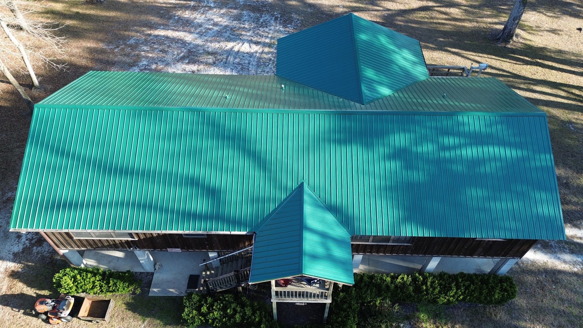 Green metal roofs installed by professional Lake City roofing companies.