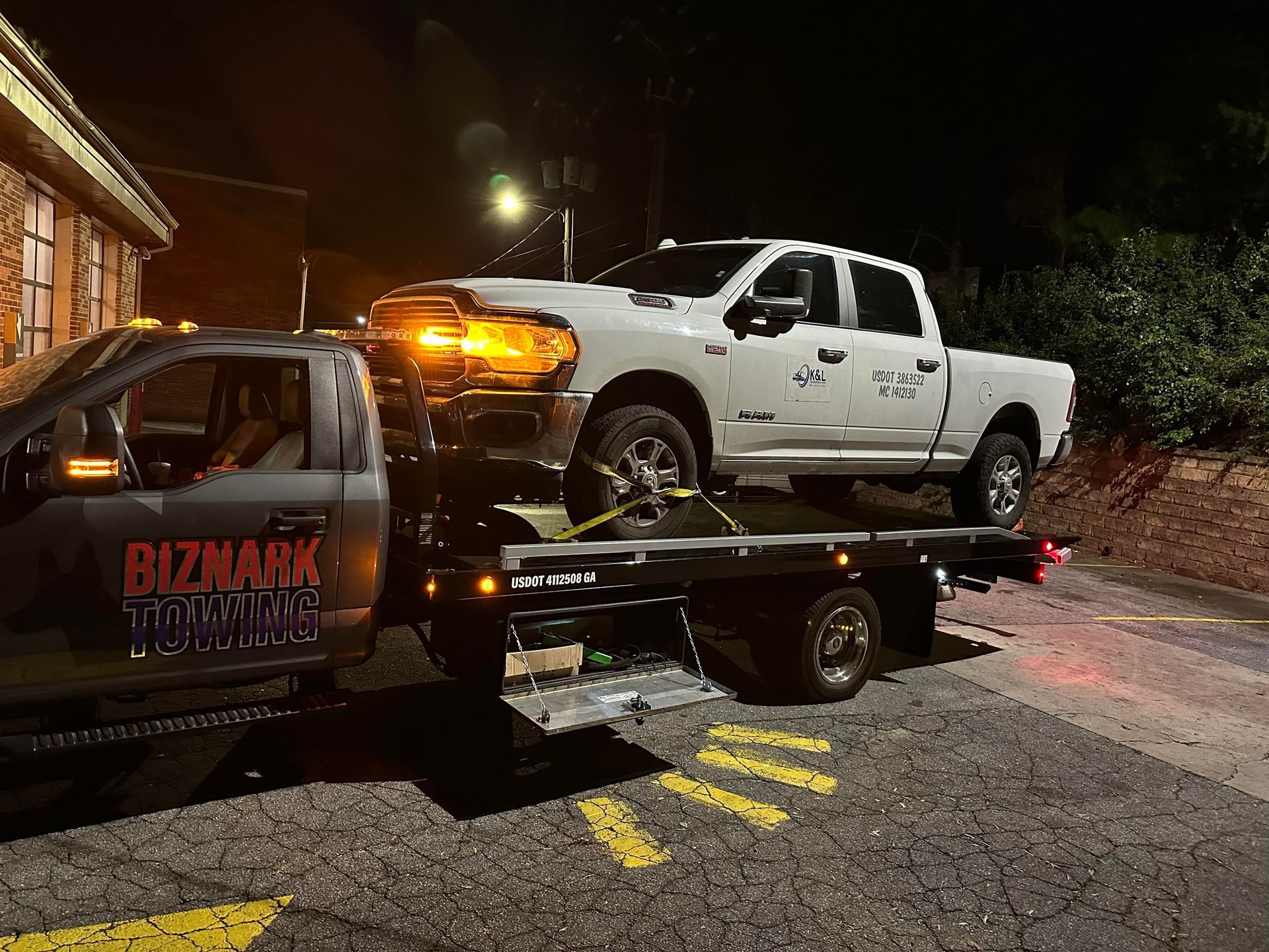 Biznark Towing towing a truck in Rosewell, GA