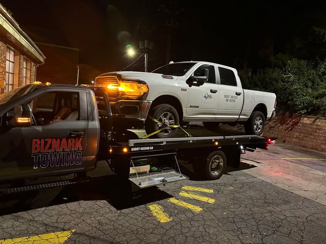 Biznark Towing towing a truck in Rosewell, GA