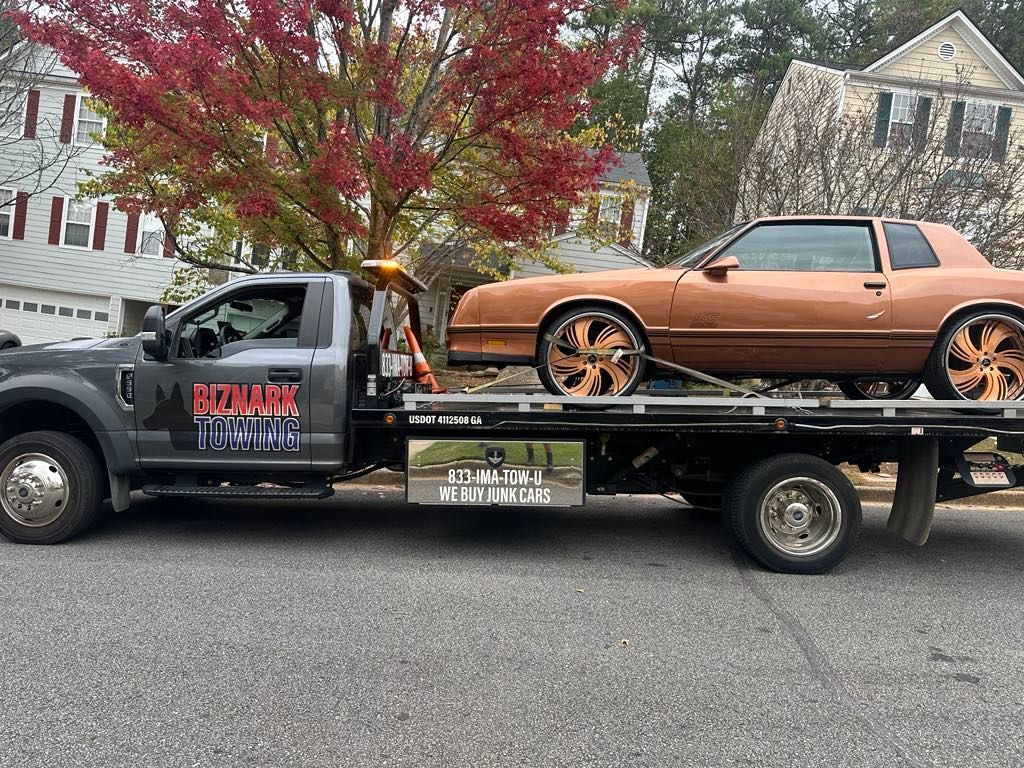 Biznark Towing a car in the Alpharetta, GA area