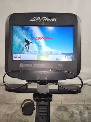 A life fitness exercise bike with a large screen.