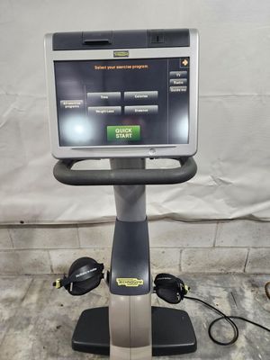 A treadmill with a monitor on top of it.