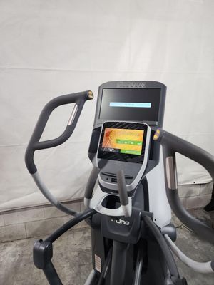 A close up of an elliptical machine with a monitor on it.