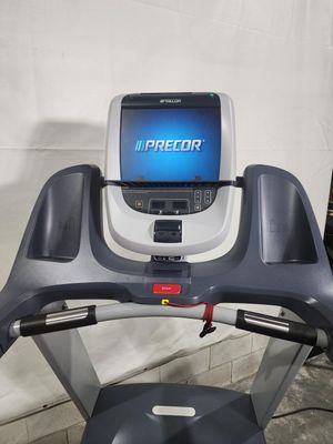 A treadmill with a monitor on top of it.