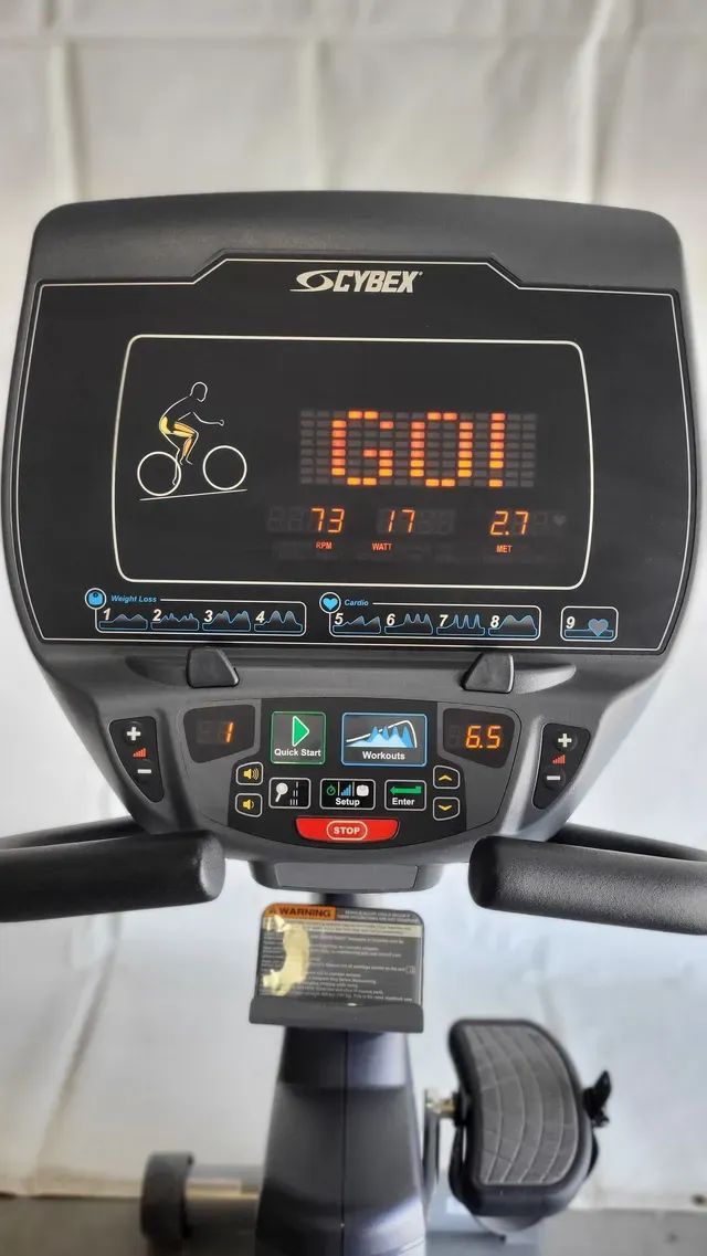 A close up of a exercise bike with a screen that says go