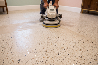 Correcting poor terrazzo restoration — professional grinding and repair in progress