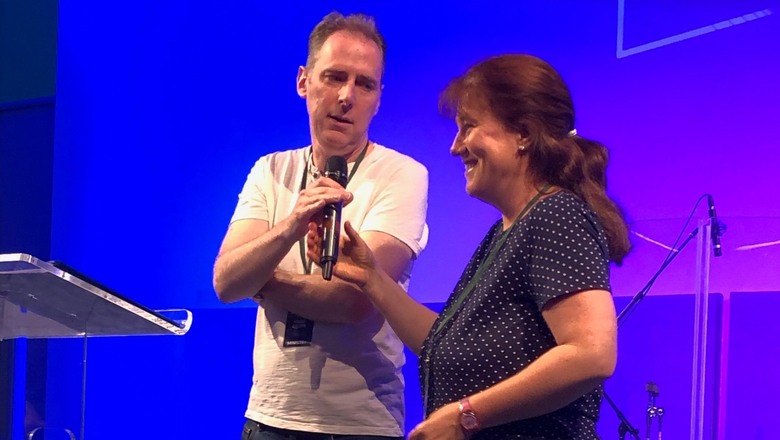 Mark & Fiona Gilpin speaking at a church.