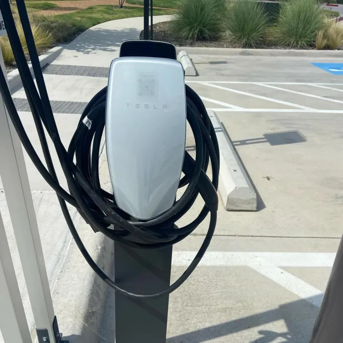 Panther City Electric LLC - A tesla charging station in a parking lot