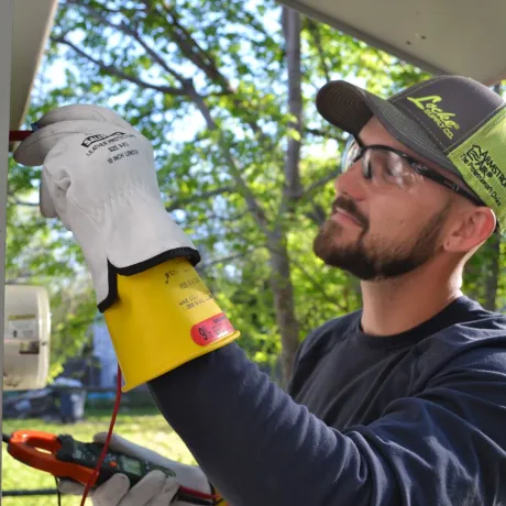 Panther City Electric LLC - A man wearing gloves and a hat that says lakers