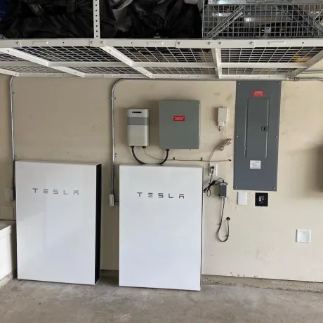 Panther City Electric LLC - A tesla solar system is installed in a garage.