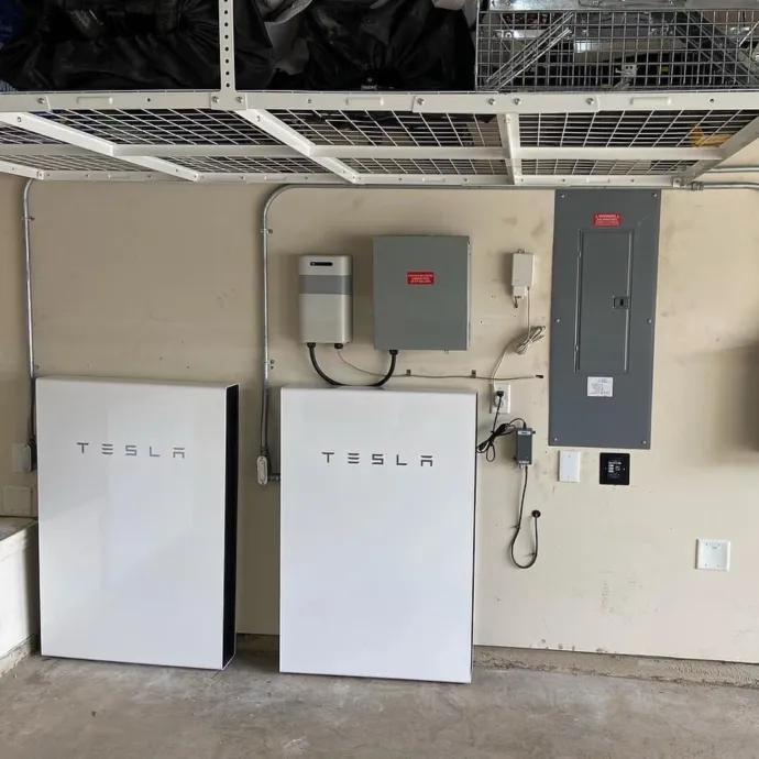 Panther City Electric LLC - A tesla solar system is installed in a garage.