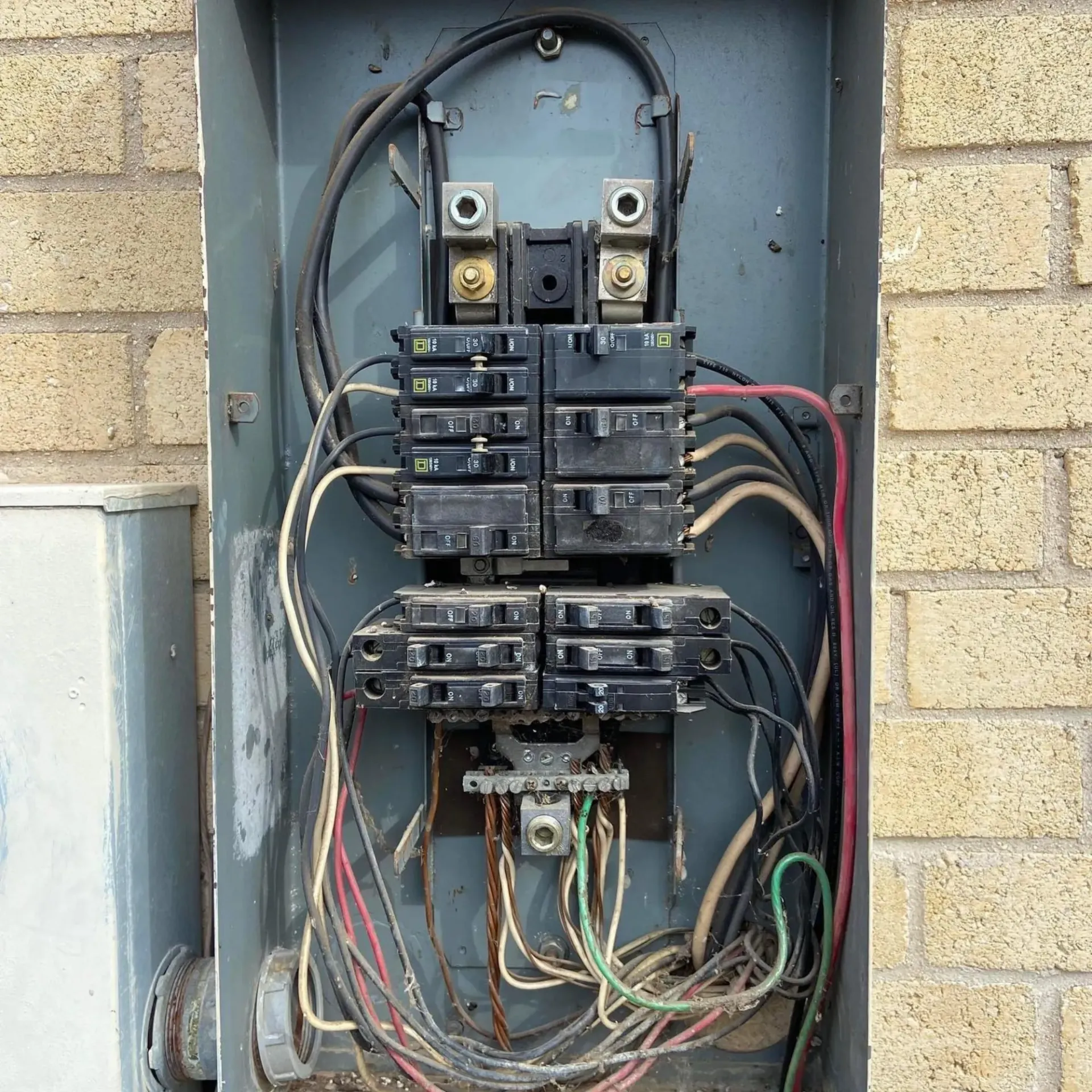 Panther City Electric LLC - A very old electrical box with a lot of wires coming out of it