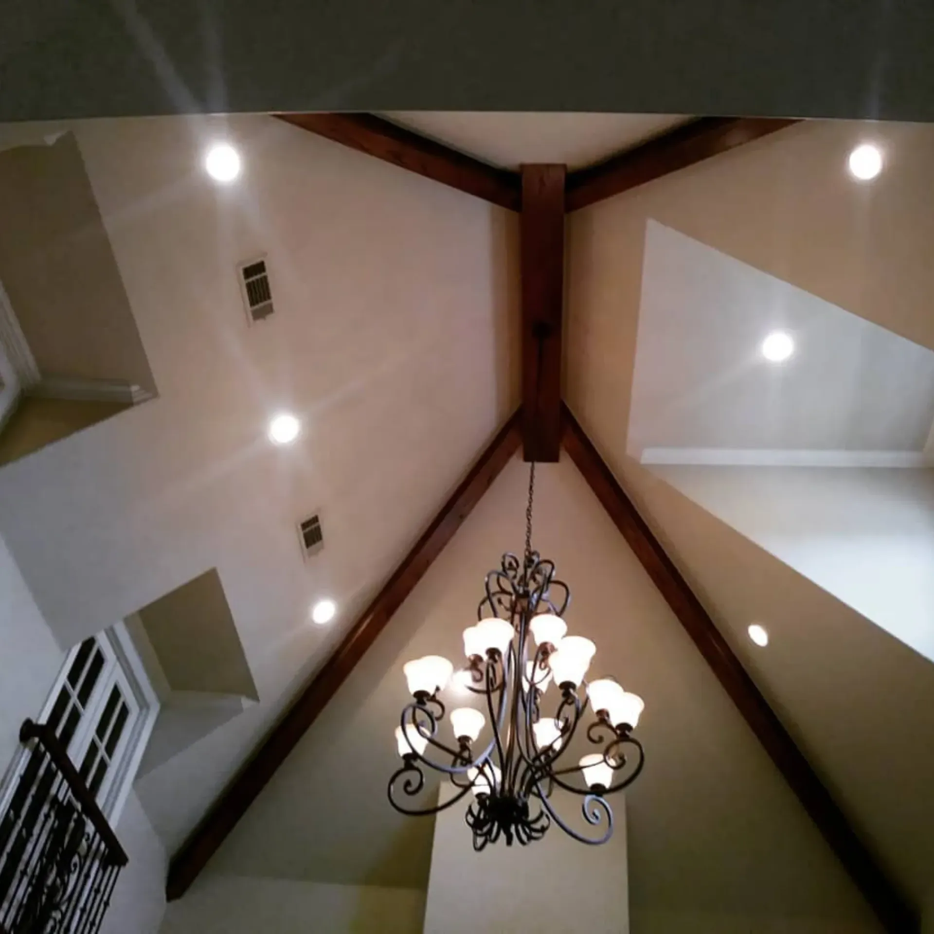 Panther City Electric LLC - A chandelier hangs from the ceiling of a room