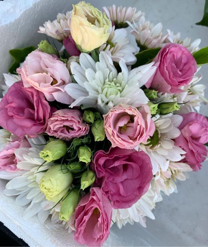 A Bouquet Of Pink And White Flowers On A Table — The House of Flowers In Kirwan, QLD 