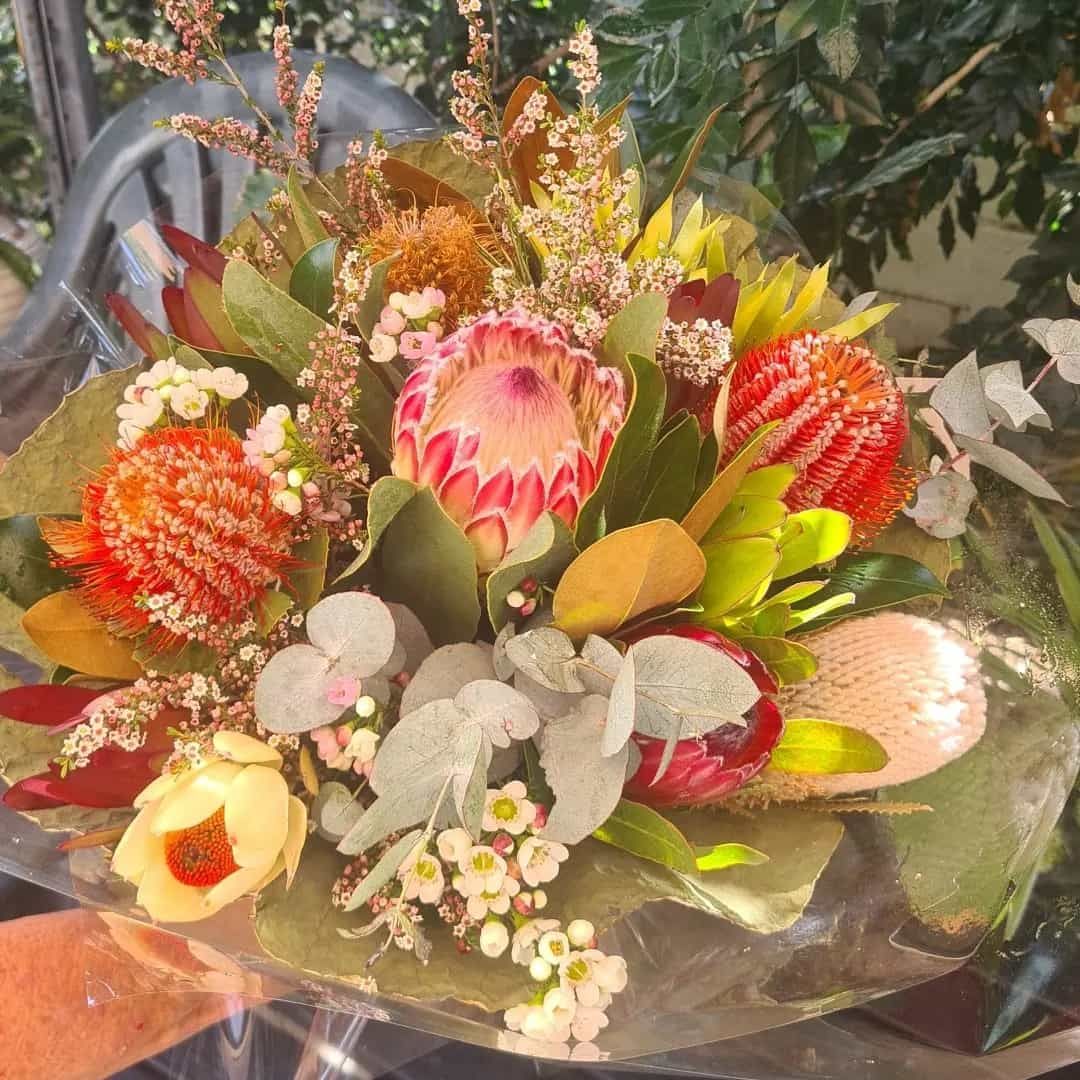 A Person Is Holding A Bouquet Of Flowers โ The House of Flowers In Kirwan, QLD