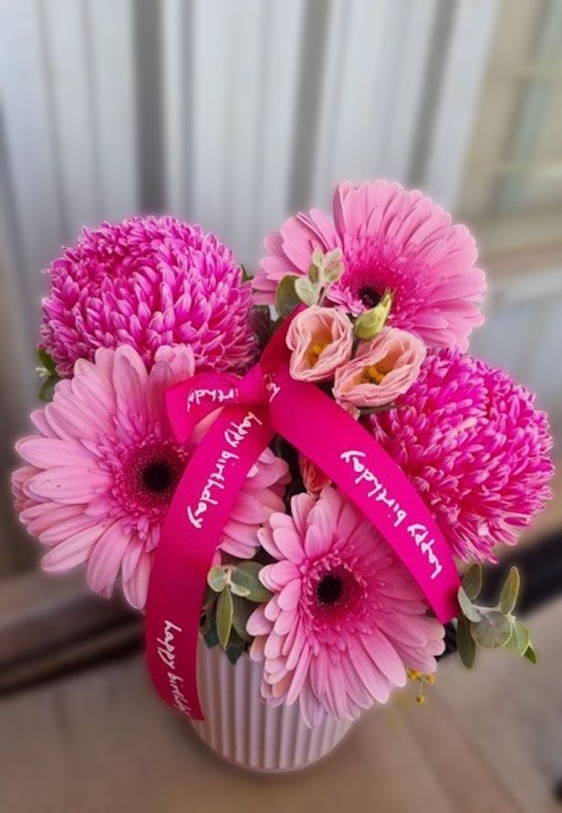 A Person Is Holding A Bouquet Of Flowers — The House of Flowers In Kirwan, QLD
