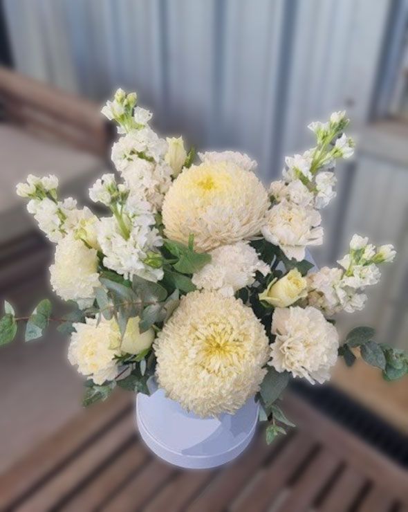A Person Is Holding A Bouquet Of Flowers — The House of Flowers In Kirwan, QLD