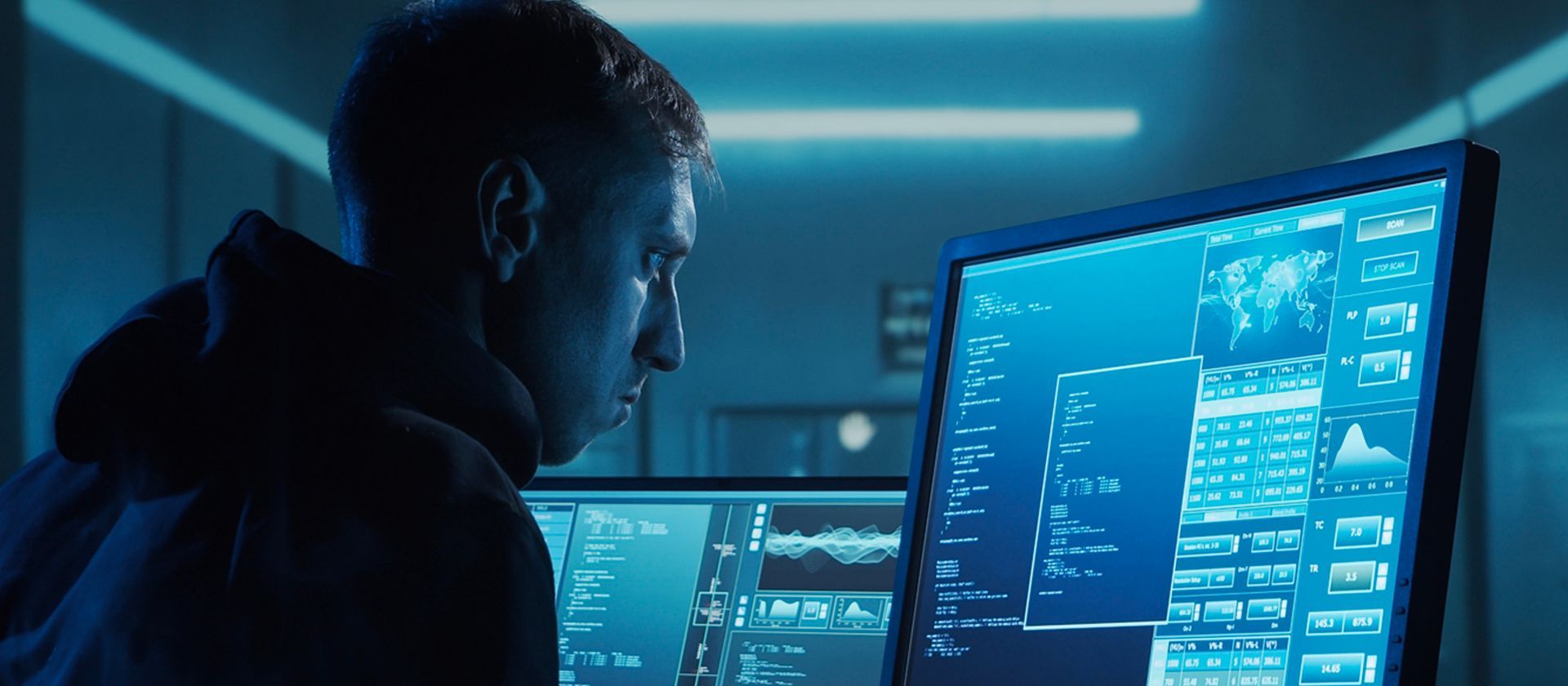 cyber security professional looking at computer screen