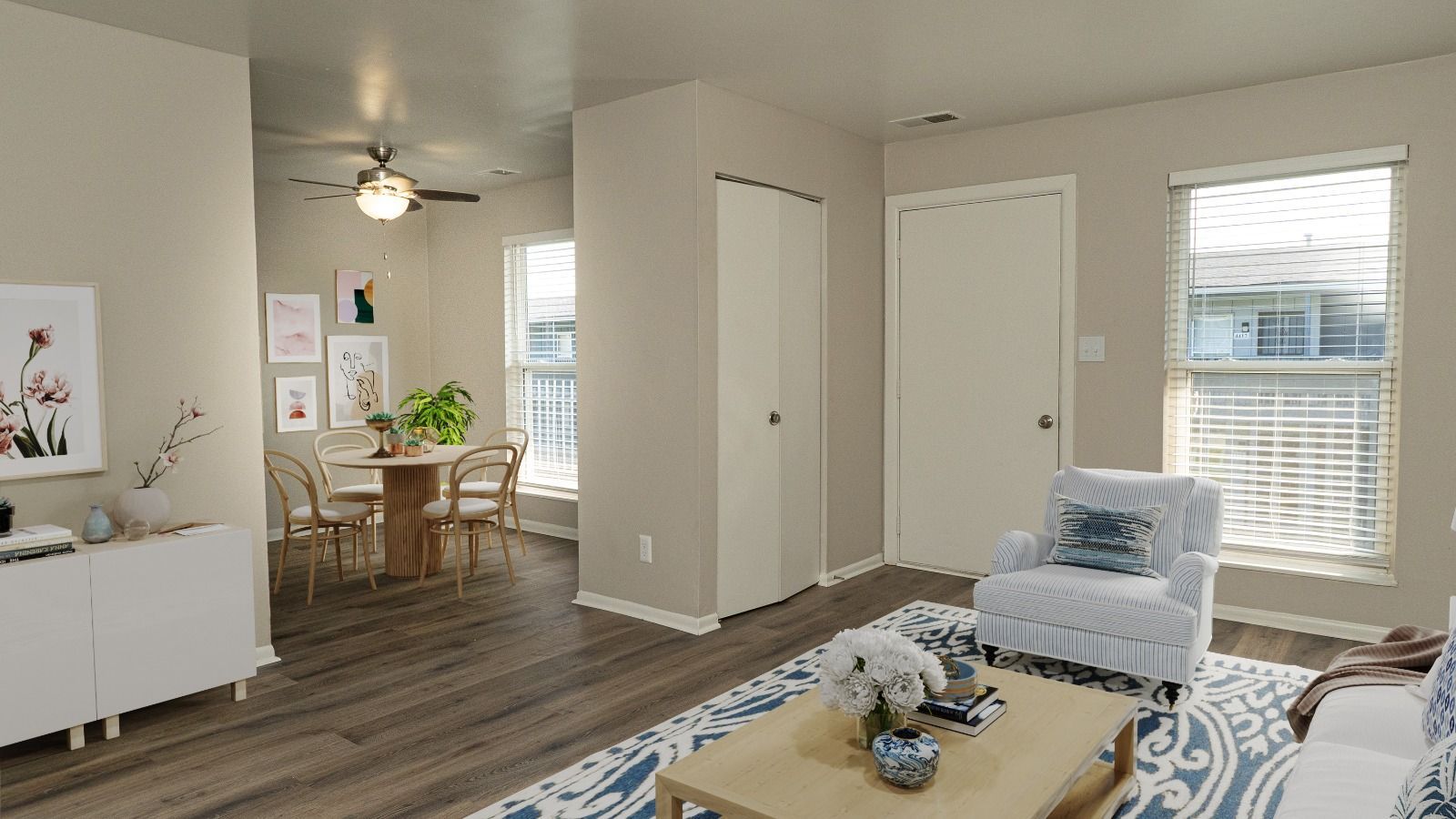unit living room with couch and chair and buffet