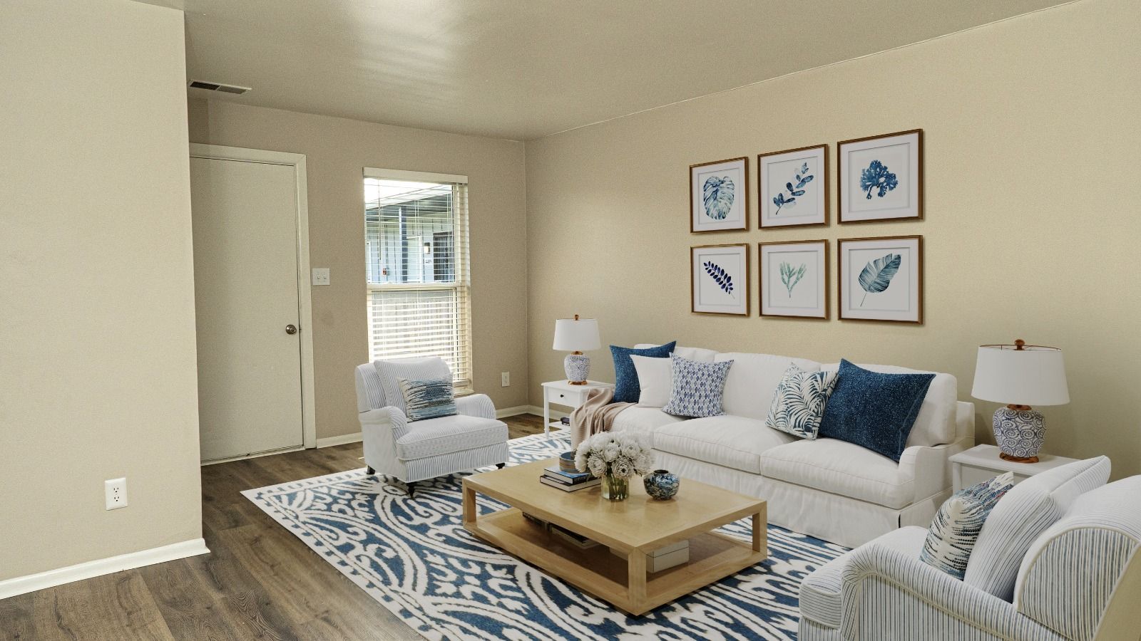 living room with couch and chairs and coffee table and rug