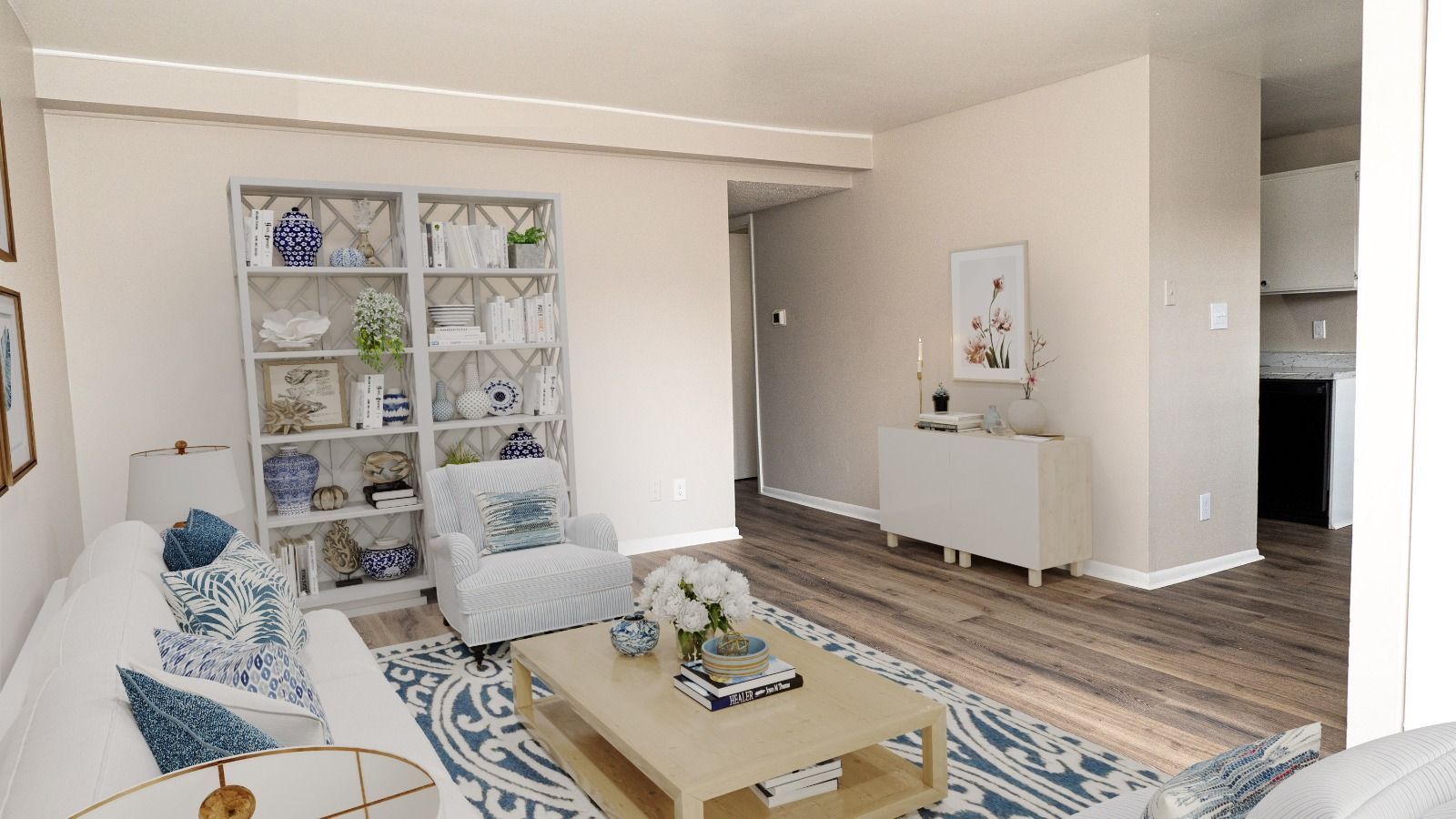 living room with decorative bookshelves, coffee table and couch and chair