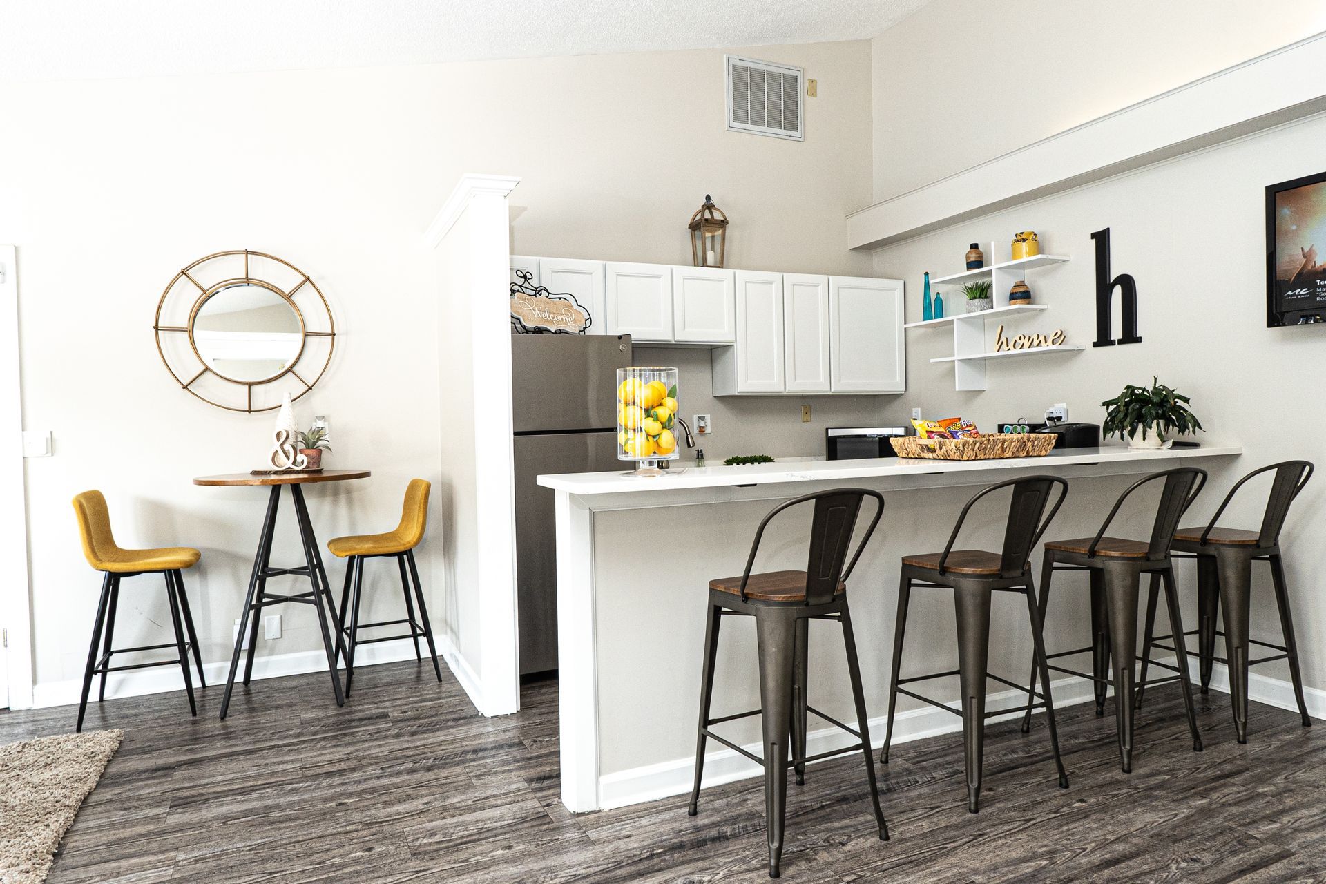 clubhouse with stools and cabinets