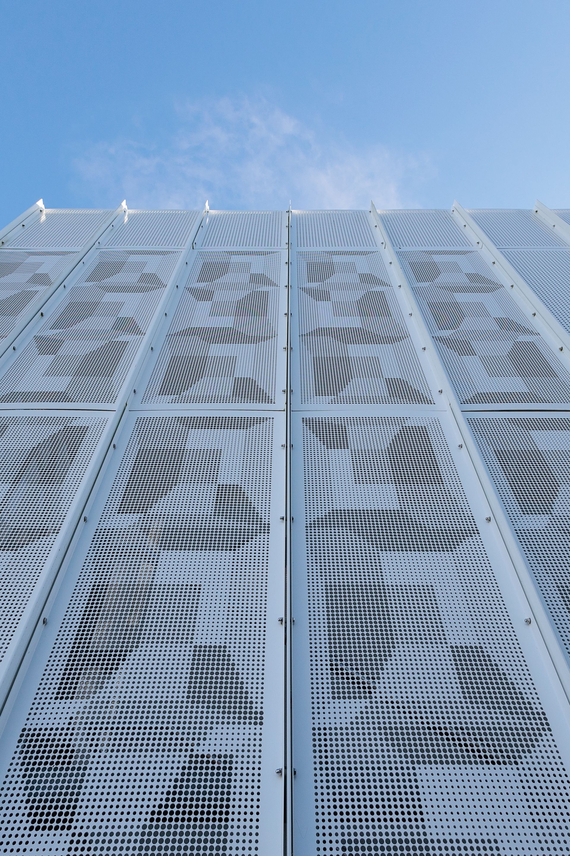 White Building Facade With Patterned Perforations — BOLD Architecture + Interior Design In Mackay, QLD