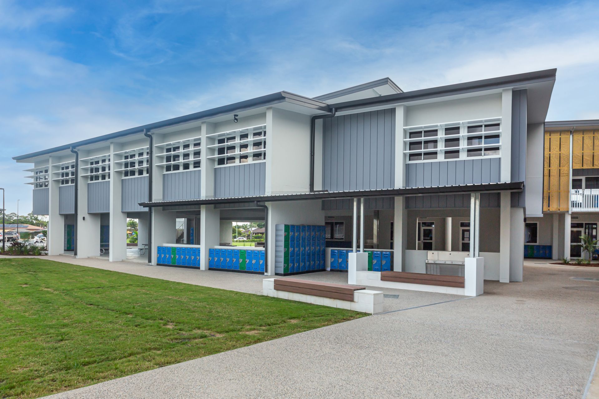 School Building With Blue Lockers, Two-story Structure and Green Lawn — BOLD Architecture + Interior Design In Mackay, QLD