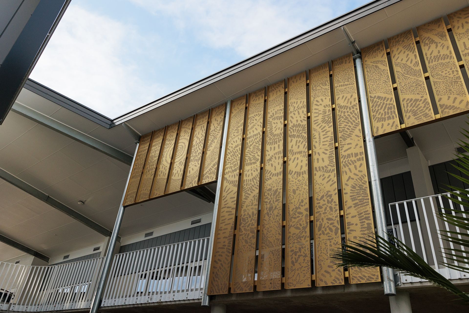 Building Facade With Vertical Wooden Panels and White Railings — BOLD Architecture + Interior Design In Mackay, QLD