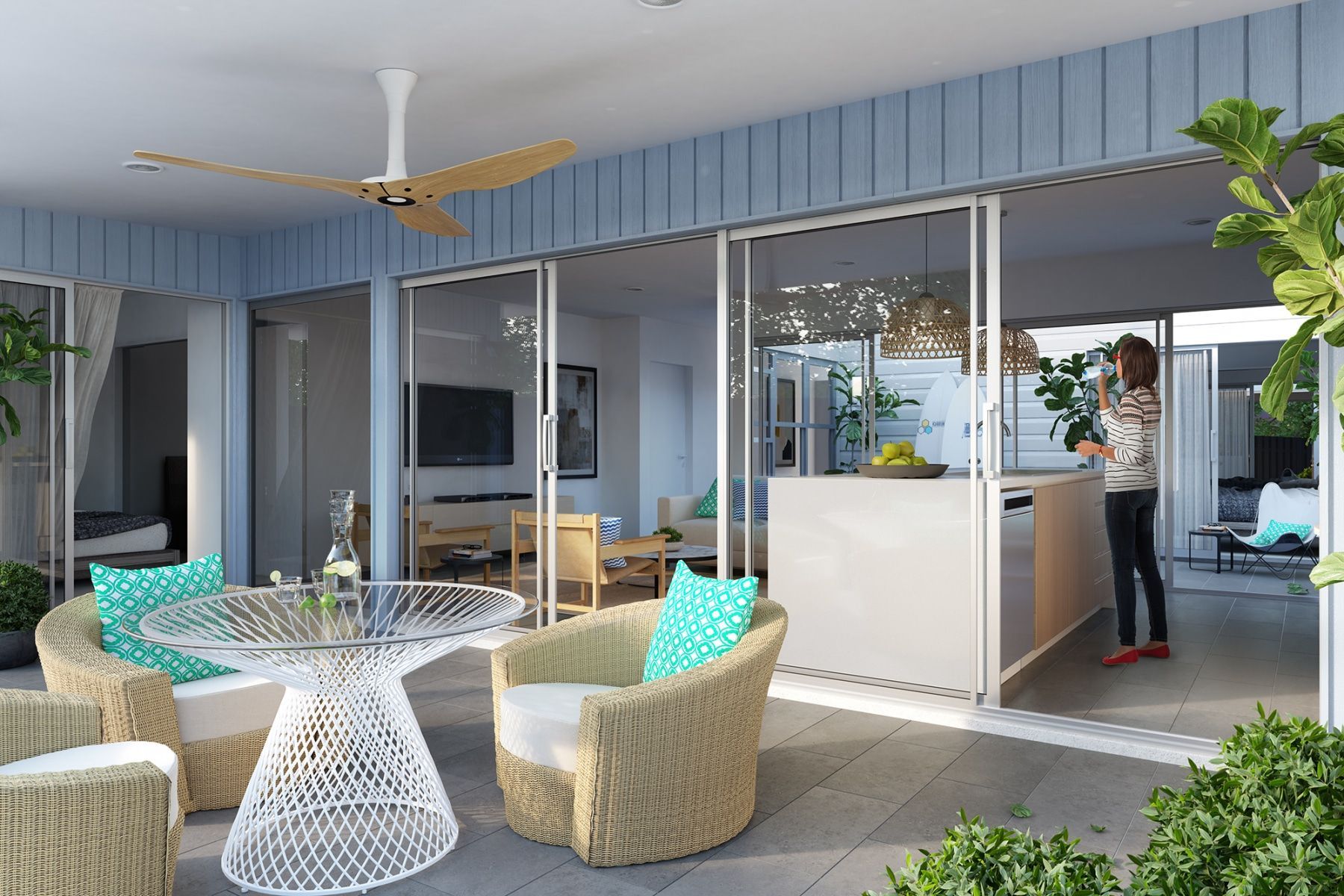 Patio With Wicker Furniture, Woman at Island, Sliding Doors, Light Blue Siding, Ceiling Fan — BOLD Architecture + Interior Design In Mackay, QLD