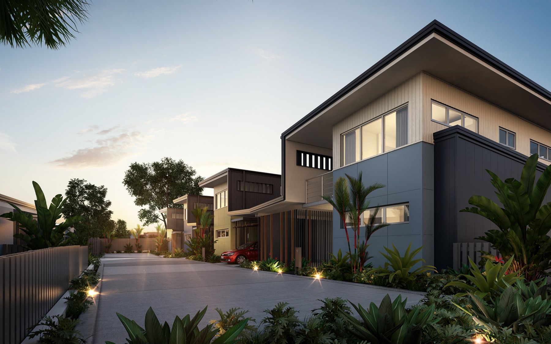 Modern Townhouses Along a Paved Road, Illuminated by Warm Lights at Dusk — BOLD Architecture + Interior Design In Mackay, QLD