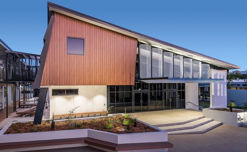 Modern Building Exterior With Angled Roof, Wood Paneling, and Glass Front Entrance — BOLD Architecture + Interior Design In Mackay, QLD