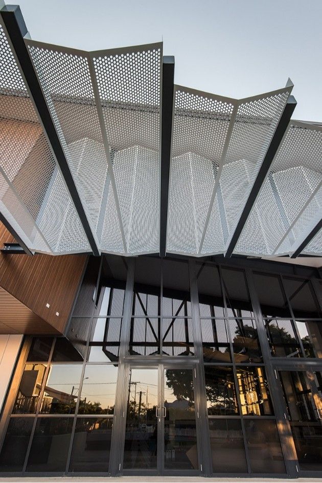 Modern Building Entrance With Patterned Roof and Glass Doors Reflecting the Surroundings — BOLD Architecture + Interior Design In Mackay, QLD