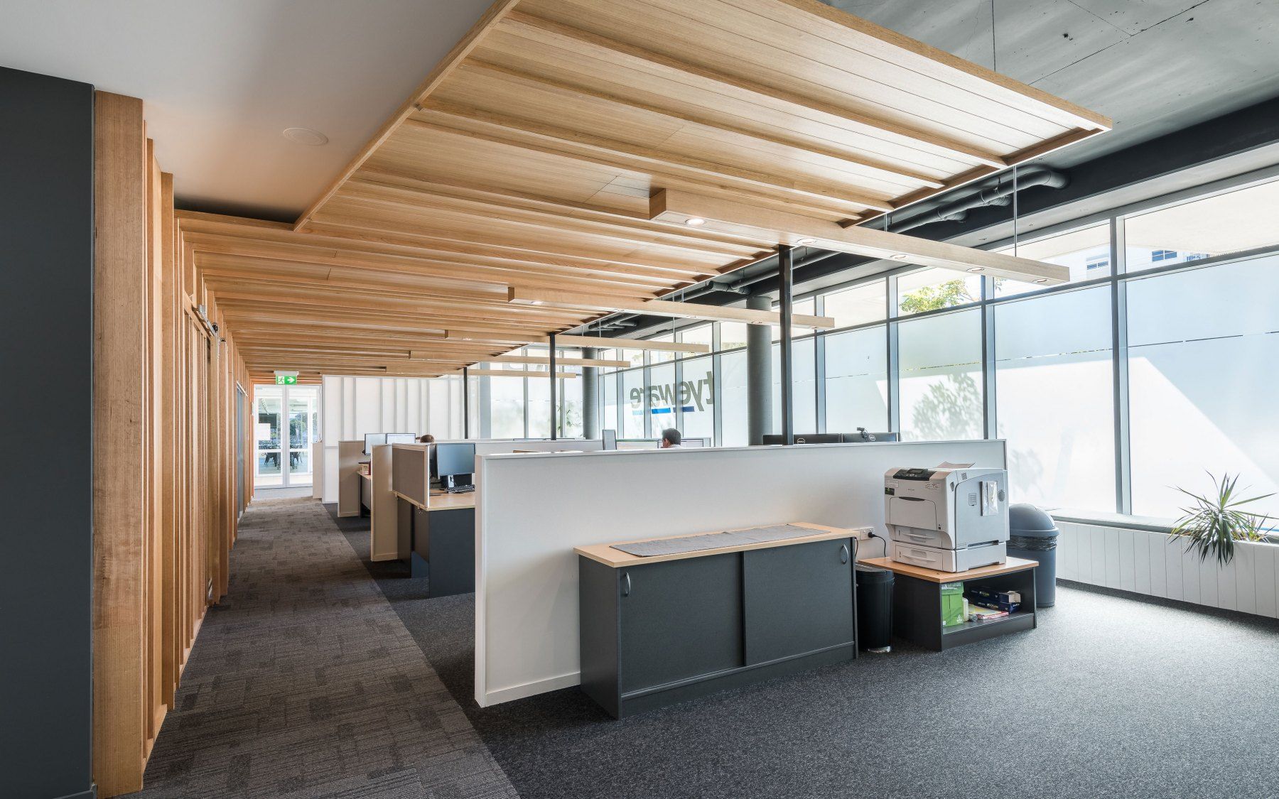 Office Interior With Wooden Accents, Desks, and Large Windows With Natural Light — BOLD Architecture + Interior Design In Mackay, QLD