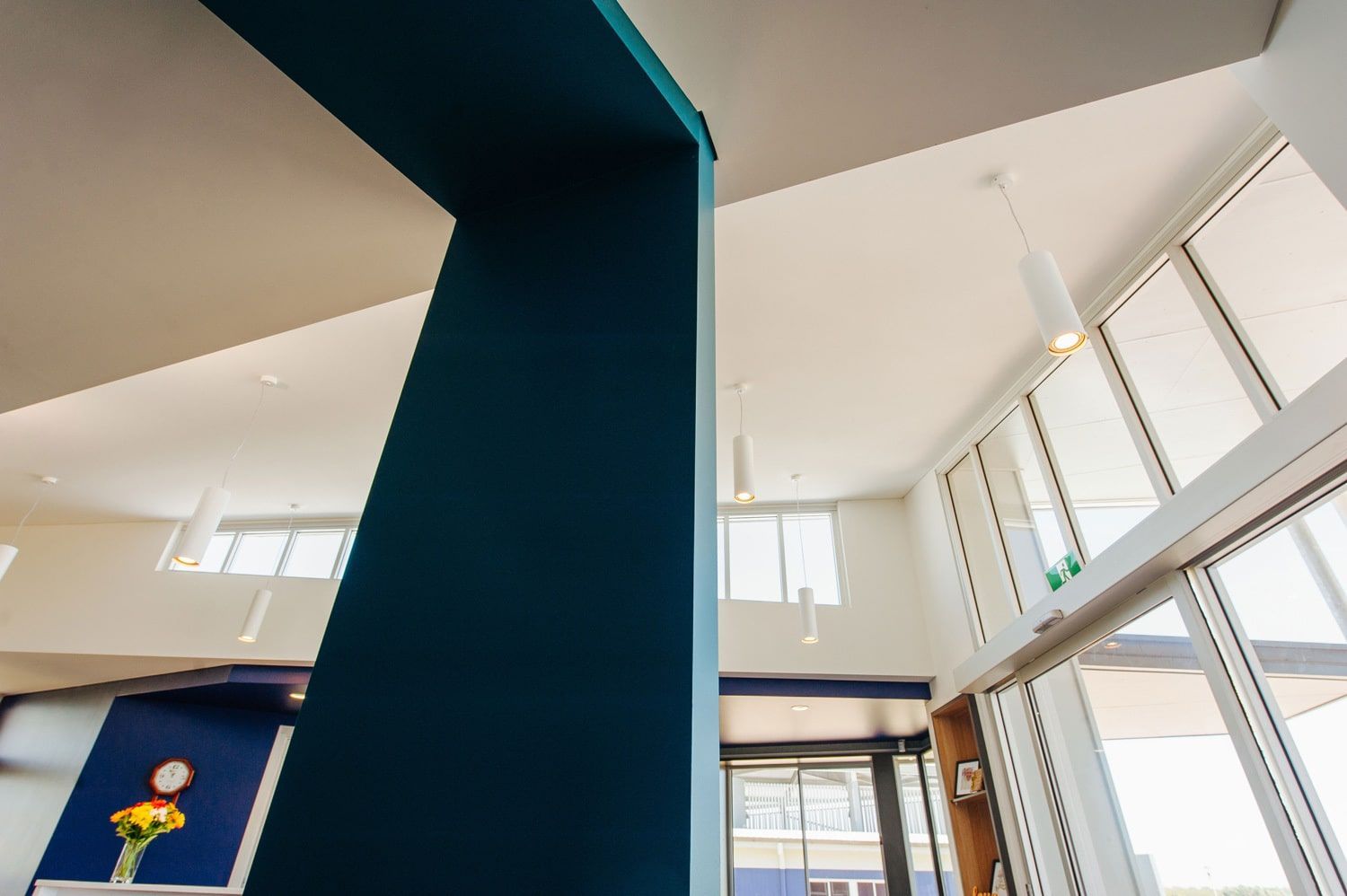 Blue Pillar in a Bright, Open Room With Large Windows and High Ceilings — BOLD Architecture + Interior Design In Mackay, QLD
