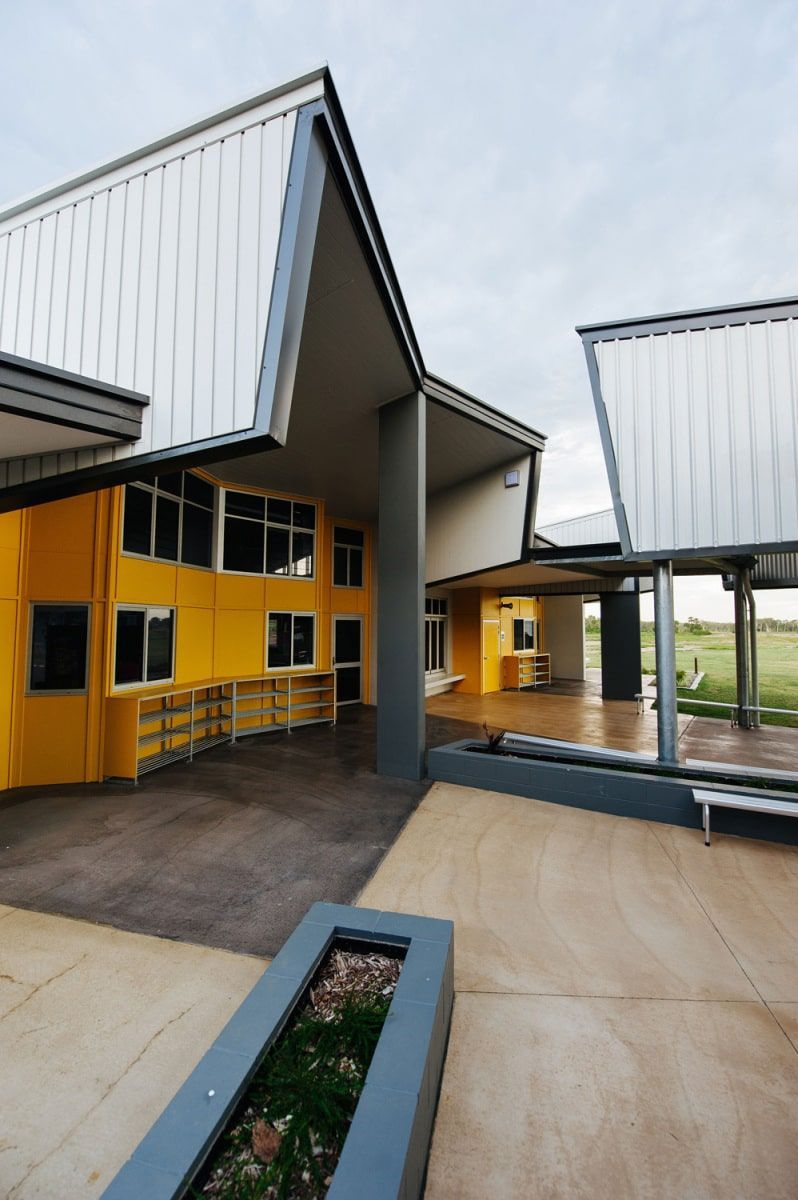 Yellow and White Modern School Building With Covered Walkways and Concrete Courtyard — BOLD Architecture + Interior Design In Mackay, QLD