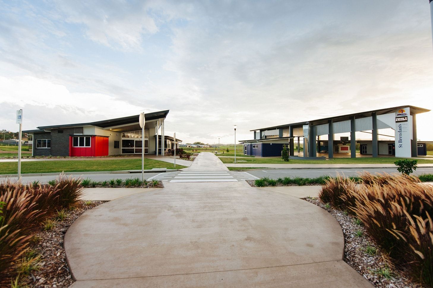 Two Modern Buildings on a Concrete Path, Under a Cloudy Sky — BOLD Architecture + Interior Design In Mackay, QLD