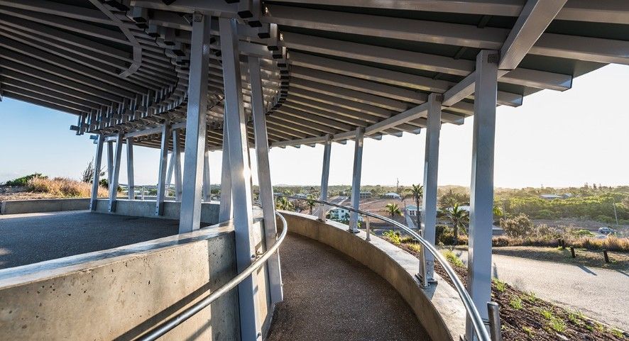 Curving Walkway Under a Silver-framed Canopy With a View of a Sunny Horizon — BOLD Architecture + Interior Design In Mackay, QLD