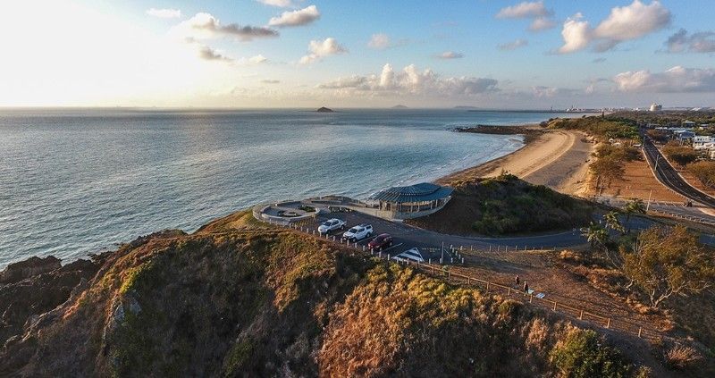 Coastal View From a Hill at Sunset, Cars Parked Near a Building — BOLD Architecture + Interior Design In Mackay, QLD