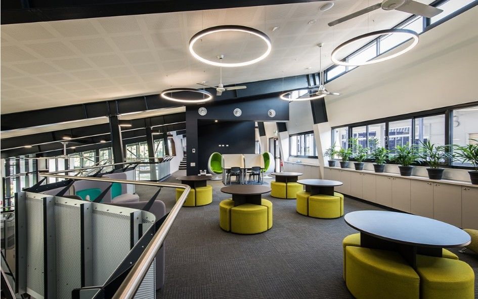 Modern Office Space With Round Tables and Yellow Seating — BOLD Architecture + Interior Design In Mackay, QLD