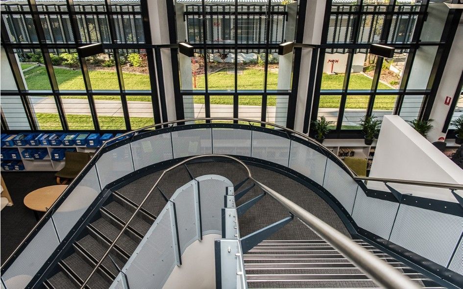 Curving Staircase With Metal Railing and Steps, Leading Downwards — BOLD Architecture + Interior Design In Mackay, QLD